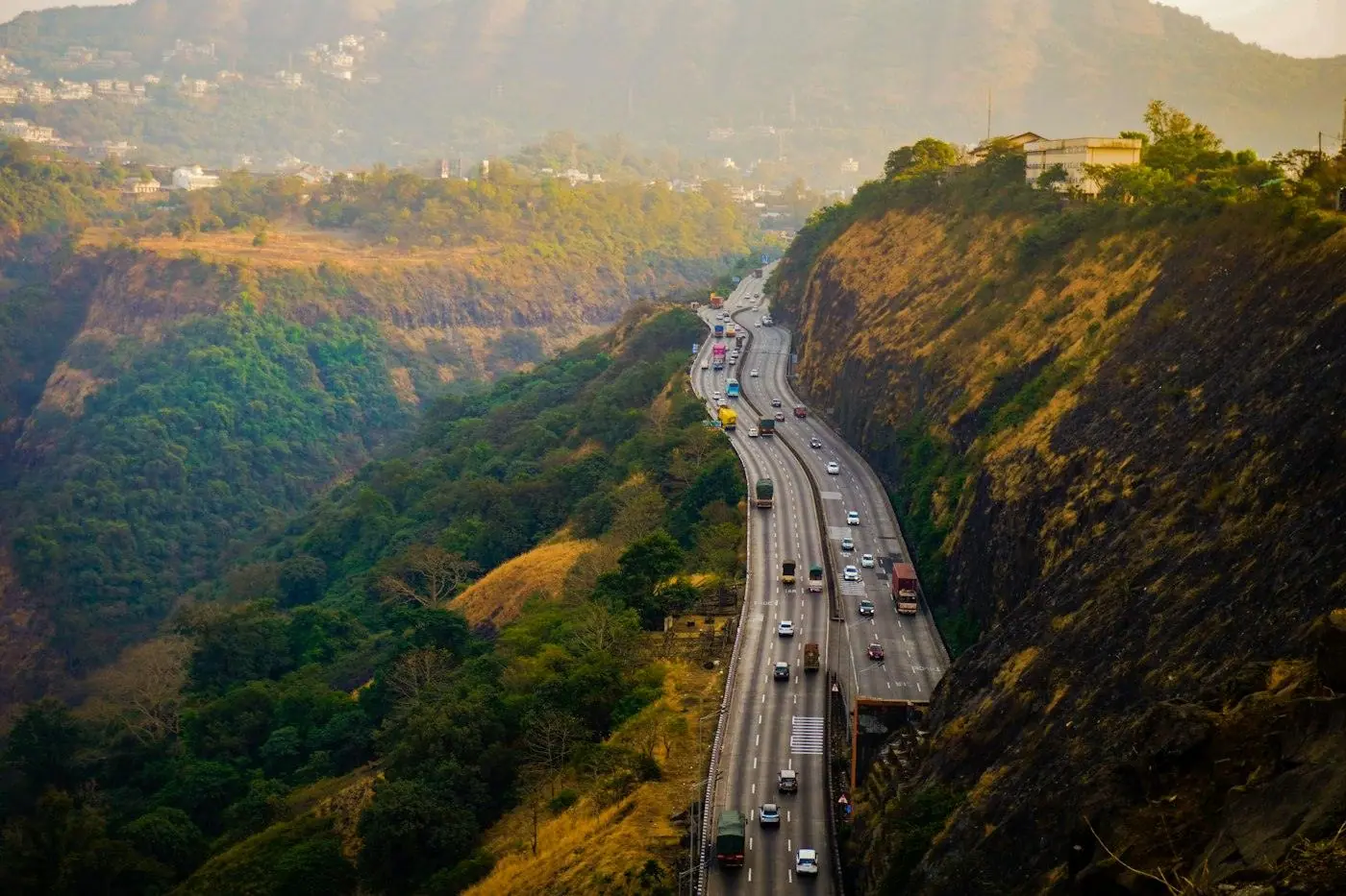 Expressway winding through green hills in India